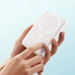 Hand holding the compact Baseus EnerFill FM41 Moon White MagSafe power bank